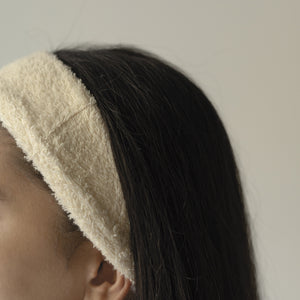 Set of two soft terry cotton headbands, plush and stretchy, designed for comfortable hair styling or skincare routines.