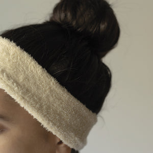 Set of two soft terry cotton headbands, plush and stretchy, designed for comfortable hair styling or skincare routines.