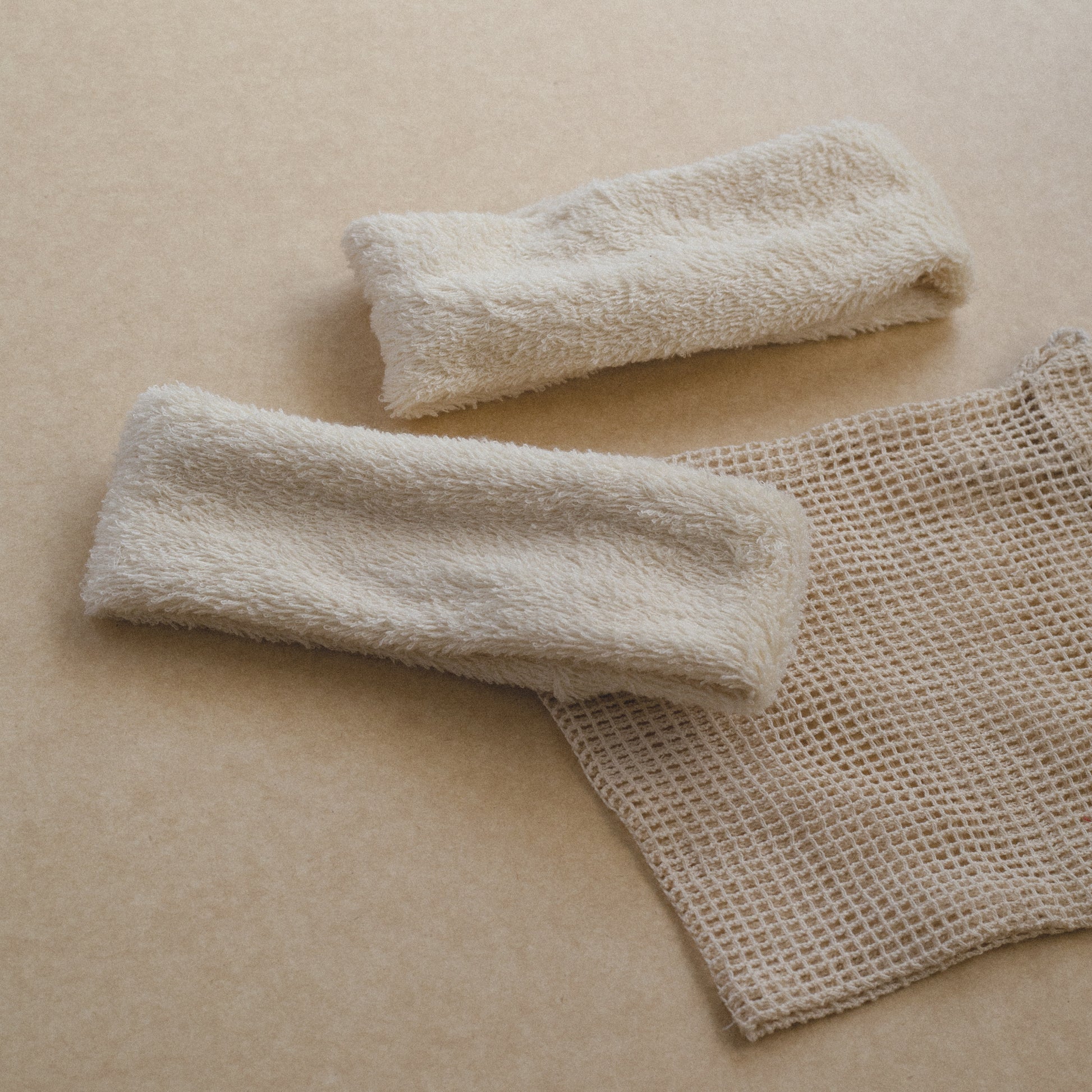 Set of two soft terry cotton headbands, plush and stretchy, designed for comfortable hair styling or skincare routines.