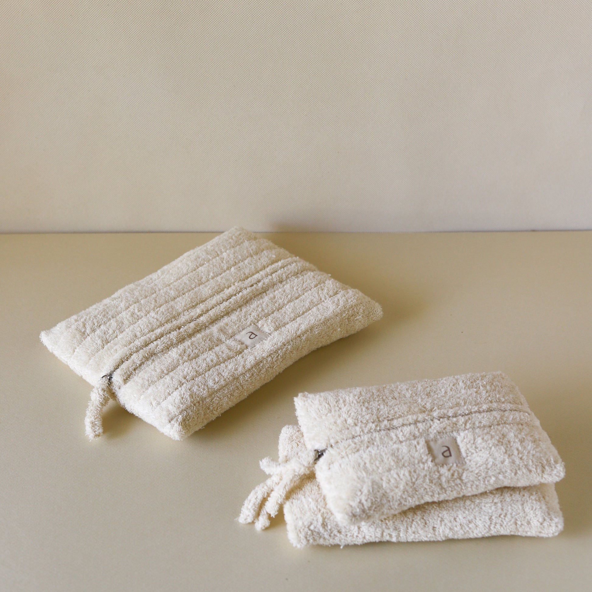 Set of three cloud-inspired cotton terry rectangle pouches, front view